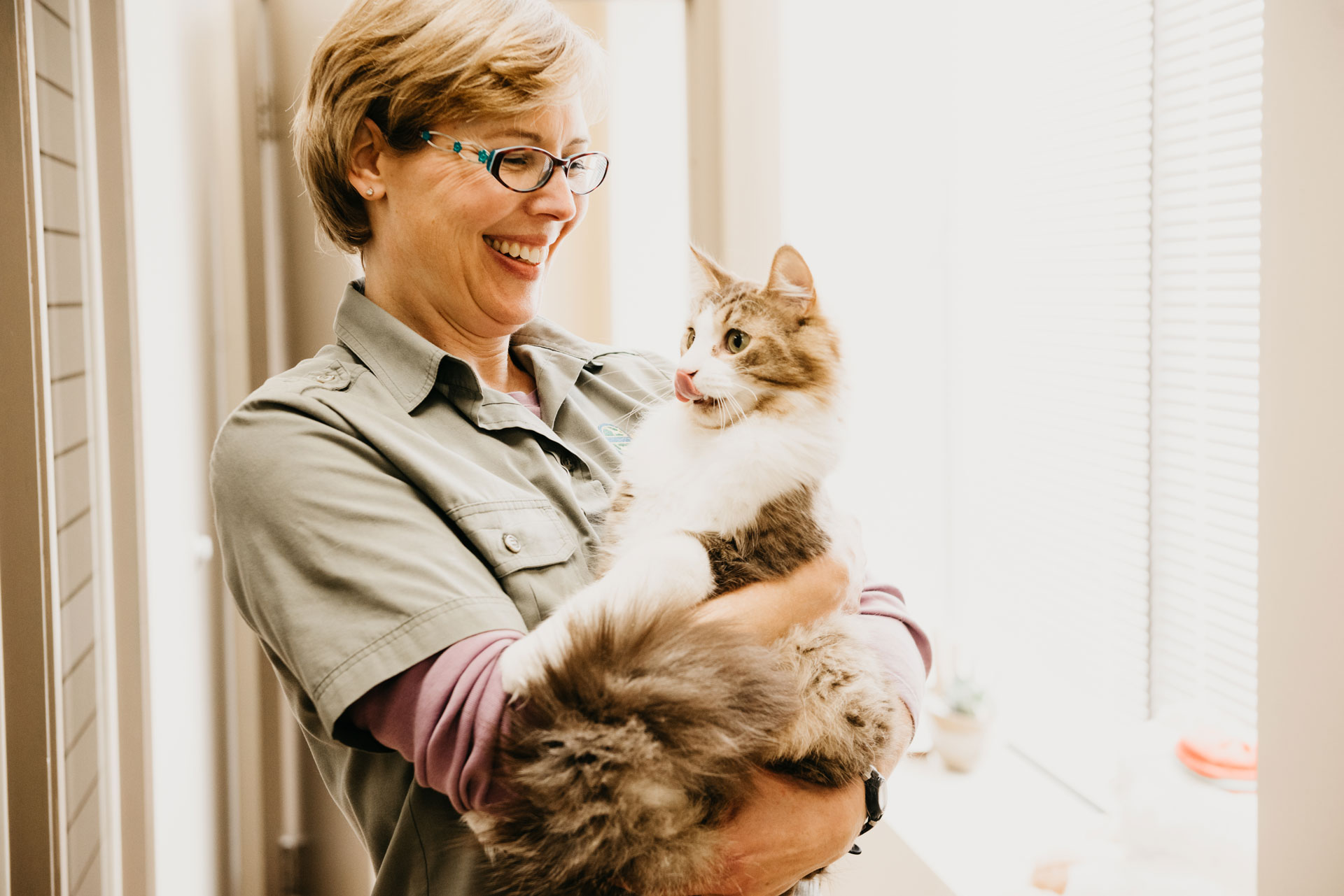 woman holding cat